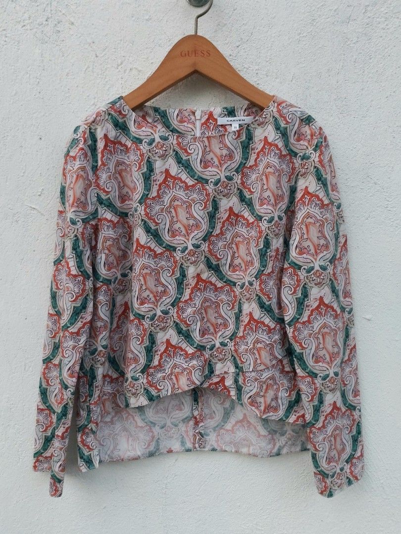 Carven patterned long sleeve blouse size 36 (Category: Longsleeves) located in Lapu Lapu. Submitted by agnesapm_29813 (Listing ID 1467294644, Image 1). Description: - Brand: Carven - Size: 36 (Small) - Pattern: Multicolor paisley (orange, green, white) - Details: Long sleeves, round neckline, back zipper closure, asymmetrical hem - Condition: Excellent pre-loved condition - Measurements: width-18 inches, height-19 inches .
