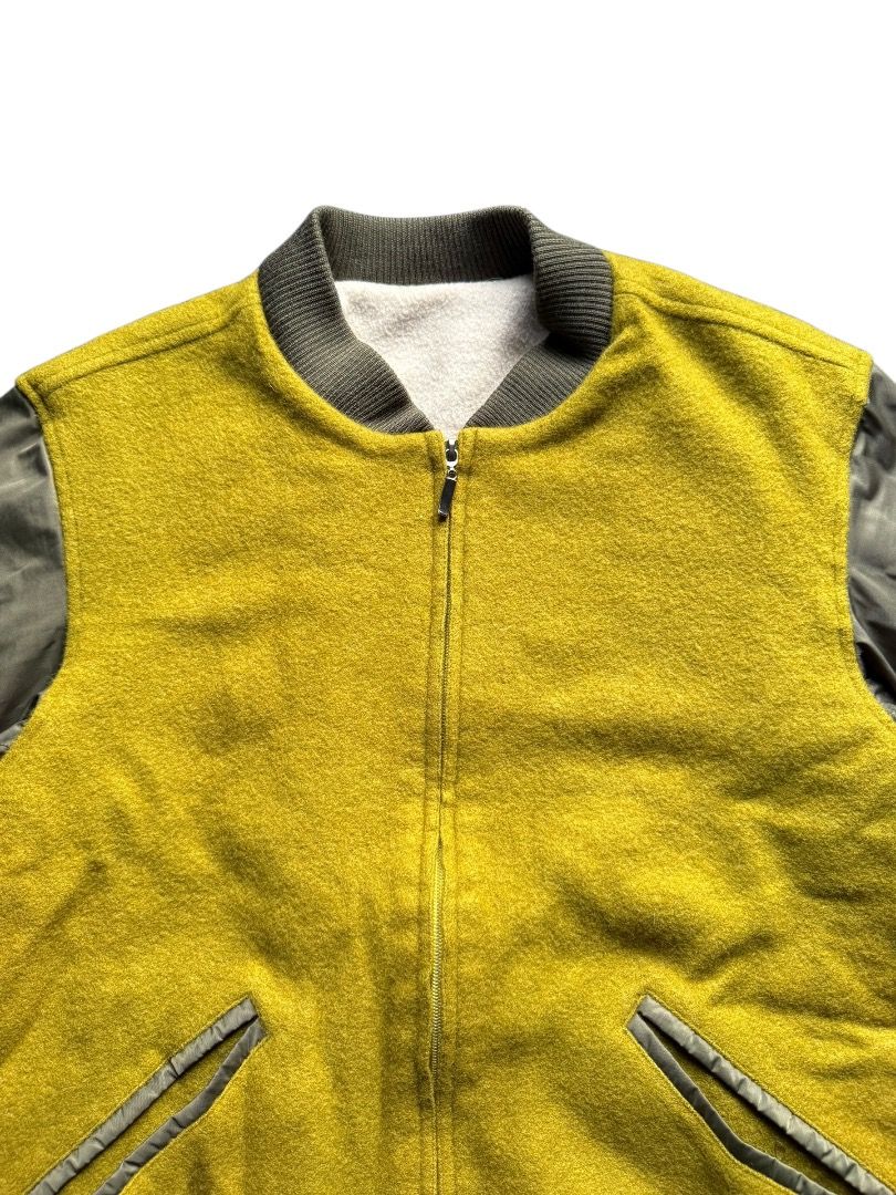 Casero Republic Yellow Bomber Jacket (Category: Coats, Jackets and Outerwear) located in Pasig City. Submitted by hoardwrld (Listing ID 1467178554, Image 2). Description: Width: 20 Length: 25 - Brand: Casero Republic - Style: Bomber jacket with zip-up front and two slanted pockets - Color: Mustard yellow textured front with greyish-olive sleeves - Comfort: Warm fleece lining with ribbed collar, cuffs, and hem - Size: Tagged Size 46 - Condition: C