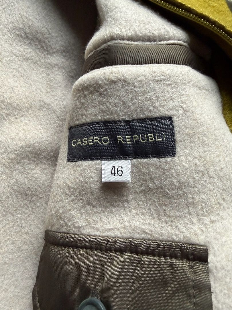 Casero Republic Yellow Bomber Jacket (Category: Coats, Jackets and Outerwear) located in Pasig City. Submitted by hoardwrld (Listing ID 1467178554, Image 3). Description: Width: 20 Length: 25 - Brand: Casero Republic - Style: Bomber jacket with zip-up front and two slanted pockets - Color: Mustard yellow textured front with greyish-olive sleeves - Comfort: Warm fleece lining with ribbed collar, cuffs, and hem - Size: Tagged Size 46 - Condition: C