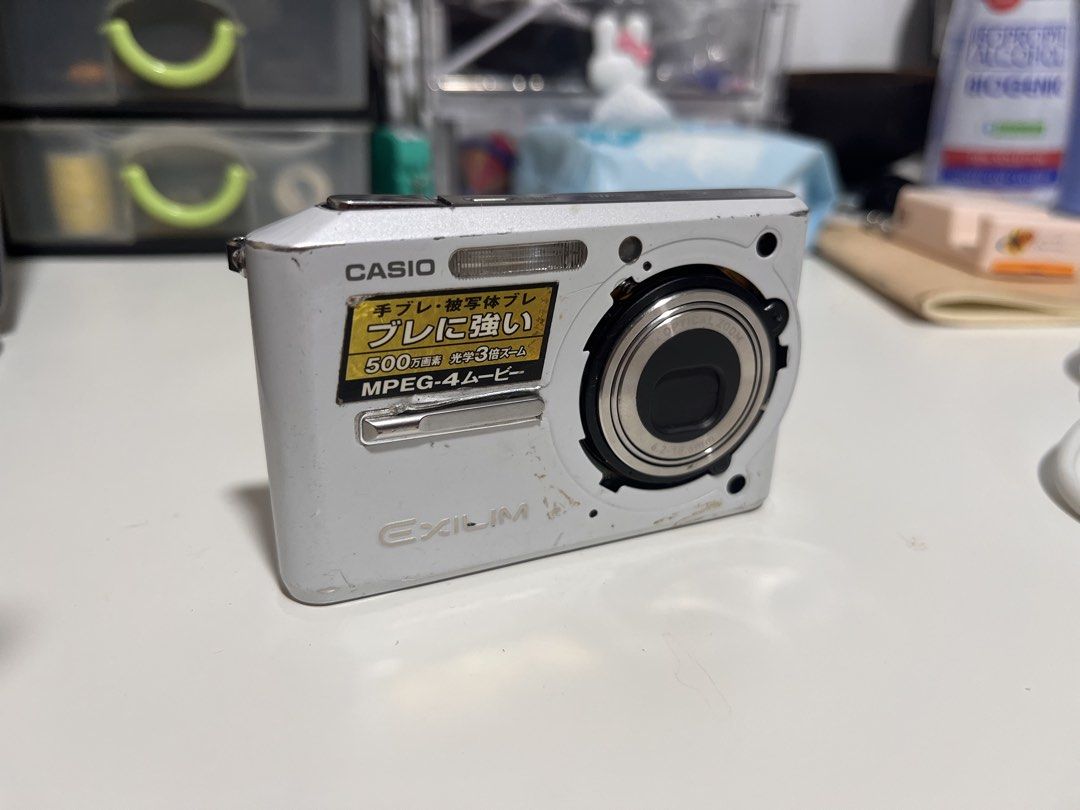 Casio Exilim EX-S500 Digital Camera White with issues (Category: Cameras) located in Manila. Submitted by kg.items (Listing ID 1467221057, Image 1). Description: - As is, where is, buy at your own risk - Model: Casio Exilim EX-S500 Digital Camera (White) - Condition: Powers on and off, may basag lcd (needs repair), visible lens - For parts na lang siguro or paayos niyo - Inclusions: Camera unit only - For meet up or shipping lalamove or grab.