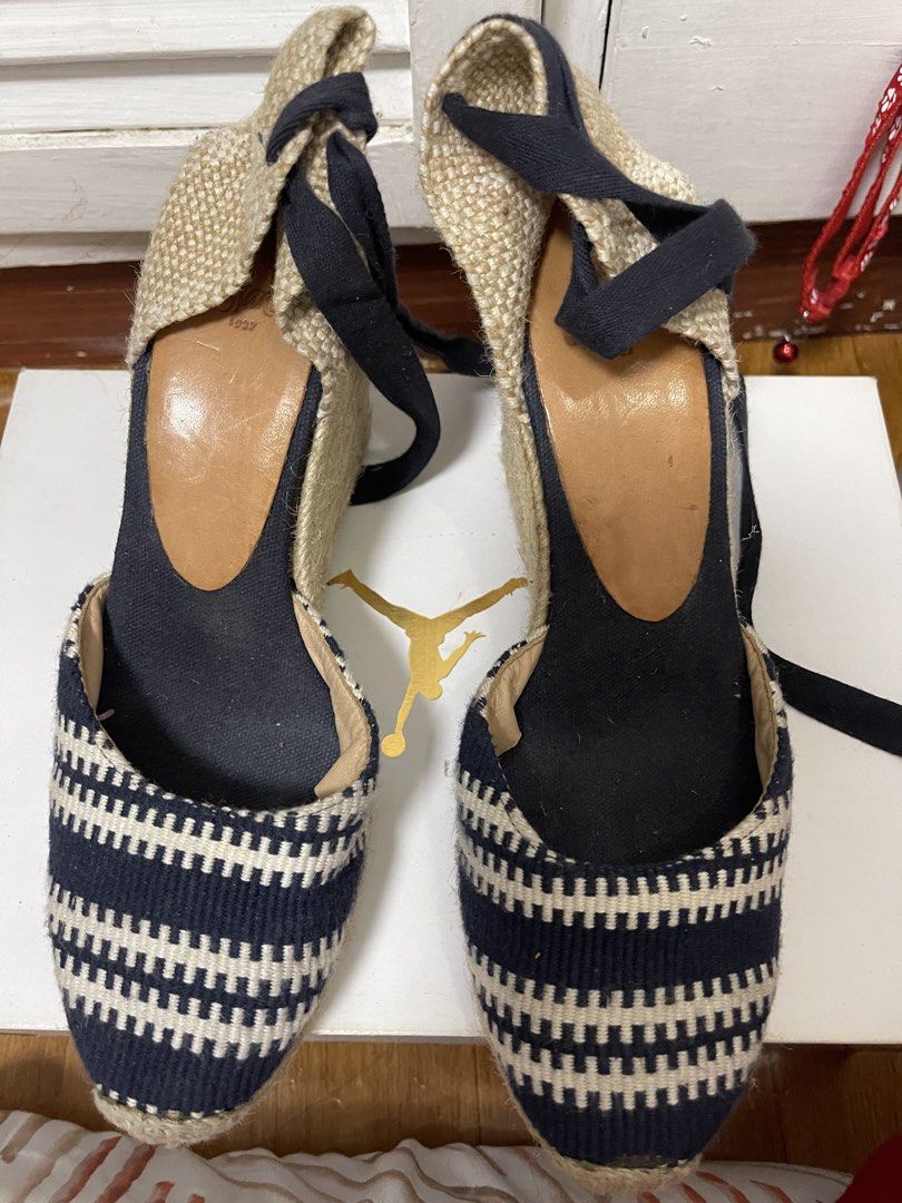 Castañer Navy and White Patterned Wedge Espadrilles Size 38 (Category: Wedges) located in Taguig. Submitted by 1307maloc (Listing ID 1467214103, Image 1). Description: - Brand: Castañer - Style: Wedge espadrilles with ankle tie ribbons - Color/Pattern: Navy and white - Size: EU 38 - Origin: Made in Spain - Material: Traditional woven jute heel and sole - Condition: Moderate wear on bottom rubber soles.
