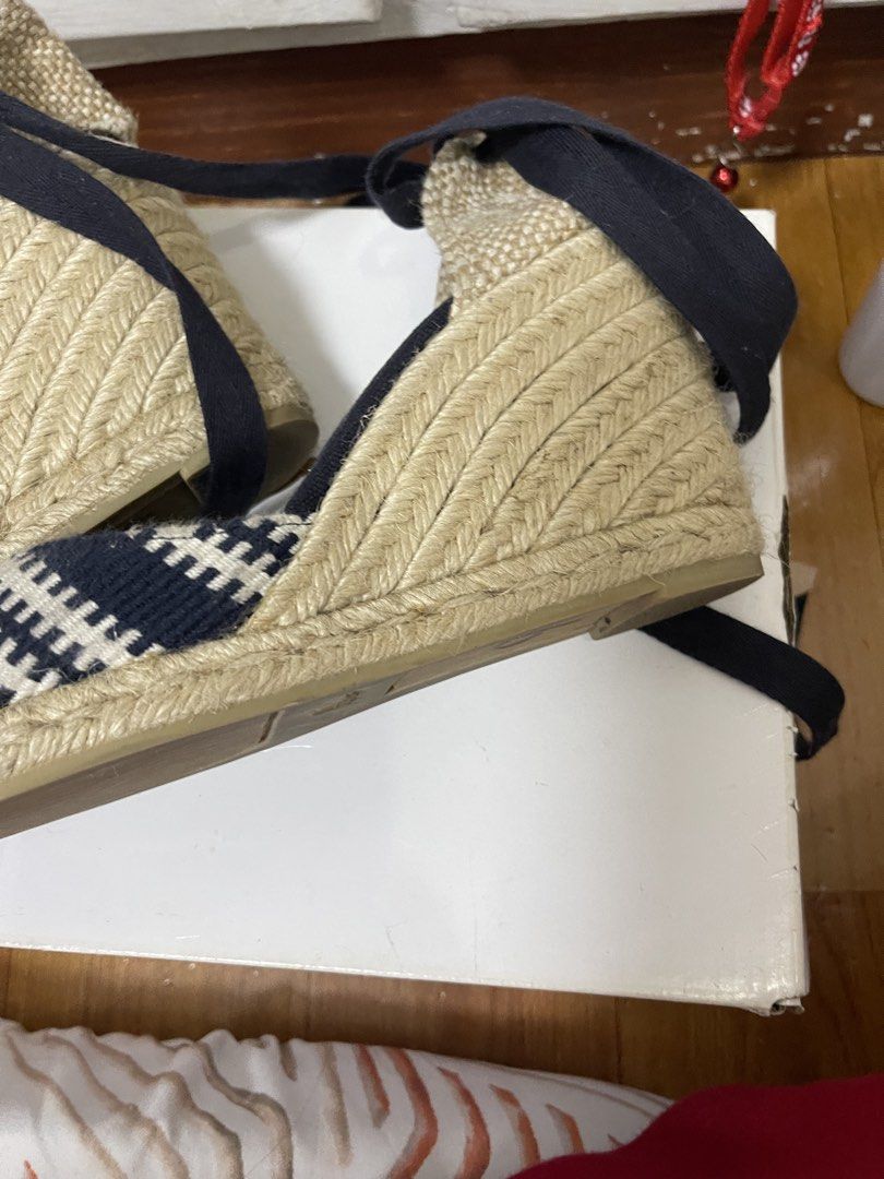 Castañer Navy and White Patterned Wedge Espadrilles Size 38 (Category: Wedges) located in Taguig. Submitted by 1307maloc (Listing ID 1467214103, Image 3). Description: - Brand: Castañer - Style: Wedge espadrilles with ankle tie ribbons - Color/Pattern: Navy and white - Size: EU 38 - Origin: Made in Spain - Material: Traditional woven jute heel and sole - Condition: Moderate wear on bottom rubber soles.