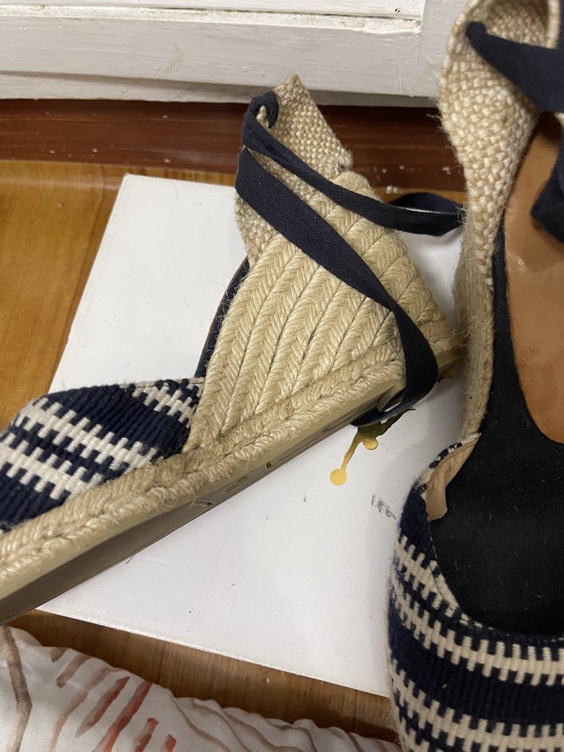 Castañer Navy and White Patterned Wedge Espadrilles Size 38 (Category: Wedges) located in Taguig. Submitted by 1307maloc (Listing ID 1467214103, Image 2). Description: - Brand: Castañer - Style: Wedge espadrilles with ankle tie ribbons - Color/Pattern: Navy and white - Size: EU 38 - Origin: Made in Spain - Material: Traditional woven jute heel and sole - Condition: Moderate wear on bottom rubber soles.