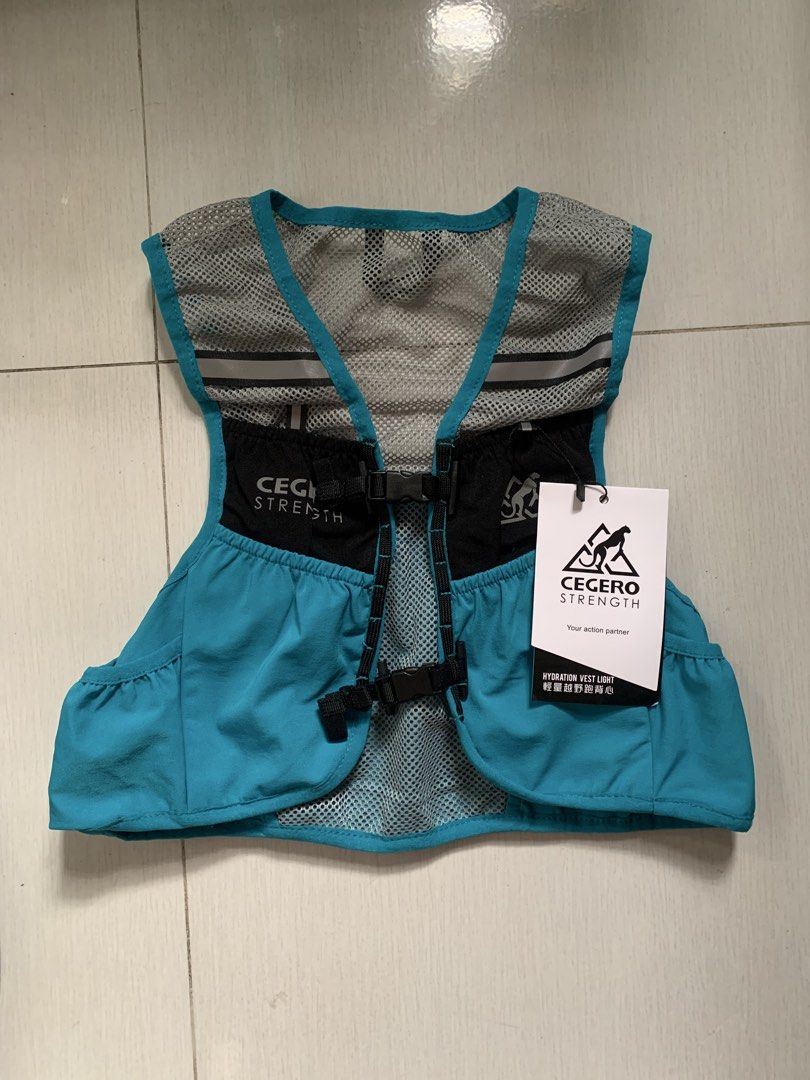 Cegero Strength Light Hydration Vest Running Backpack (Category: Other Sports Equipment and Supplies) located in Quezon City. Submitted by lijikore (Listing ID 1467176508, Image 2). Description: - Cegero Strength 4L hydration vest (bnwt) - Bright turquoise blue with black chest pockets and grey mesh panels - Dual adjustable buckle closure across the front for a secure fit - with minor flaw: please see 3rd photo (you can have it repaired) .