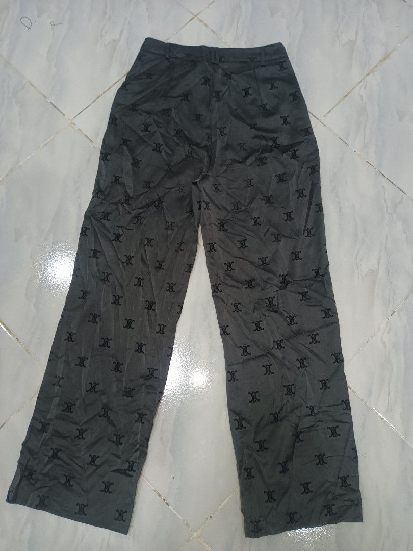 Celine Monogram Print Wide Leg Pants (Category: Jeans) located in Jolo. Submitted by zah-zah (Listing ID 1467317722, Image 2). Description: - Brand: Celine - Style: Wide leg pants with pleated front - Color / Pattern: Dark grey with allover monogram - Details: Branded gold-tone button closure, interior branding tags, Japanese care label - Material: 100% cotton - Care: Dry clean only - Condition: Excellent pre-loved condition (DM for exact measure