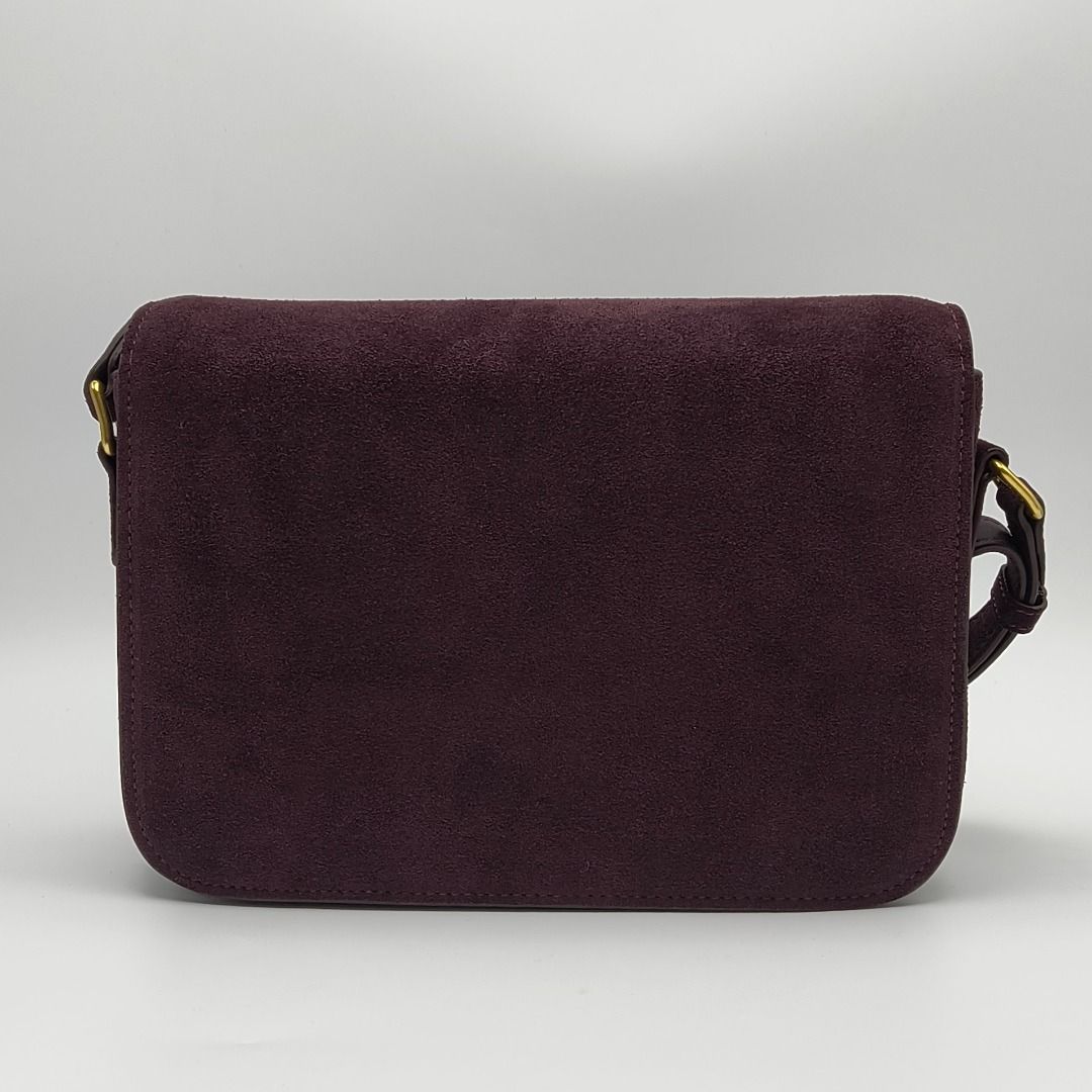 Celine Triomphe Bag Medium Burgundy Suede (Category: Luxury Bags & Wallets) located in Cebu City. Submitted by affordabagss (Listing ID 1467353277, Image 3). Description: Celine Classique Triomphe Medium bag crafted in deep burgundy suede calfskin with smooth leather trim and gold-tone hardware. Features the signature Triomphe metal clasp, curved flap, adjustable leather shoulder strap and structured rectangular silhouette. Finished with a leathe