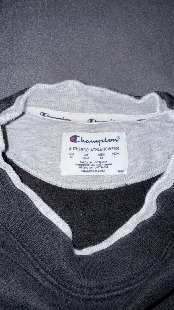 Champion Black Cropped Drawstring Sweatshirt (Category: Coats, Jackets and Outerwear) located in Andop. Submitted by nobleangel (Listing ID 1467309861, Image 3). Description: - Authentic Black Champion sweatshirt - Size: Medium (USA, CA, MEX) / Large (Asia) - Features contrast gray inner collar trim - Embroidered script logo on chest and classic C patch on left sleeve - Adjustable drawstring hem with metal aglets - Comfortable raglan sleeves - Ma
