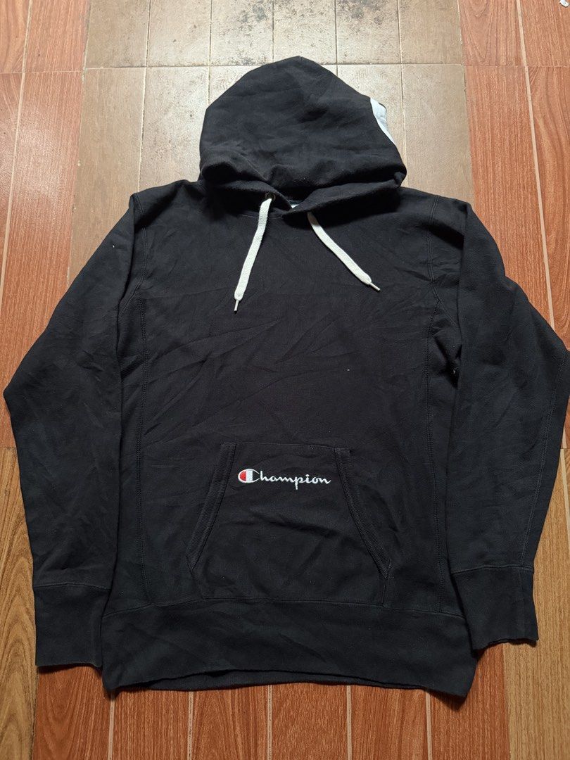 Champion Black Hoodie Sweatshirt with White Drawstrings (Category: Hoodies) located in Dasmarinas. Submitted by kylebecker (Listing ID 1467207290, Image 1). Description: - Color: Black - Brand: Champion - Features iconic embroidered script logo on the front pocket - White drawstrings and snug ribbed cuffs and hem - Standard fit for easy pairing with any casual outfit - Perfect cozy staple for colder days or lazy weekends.
