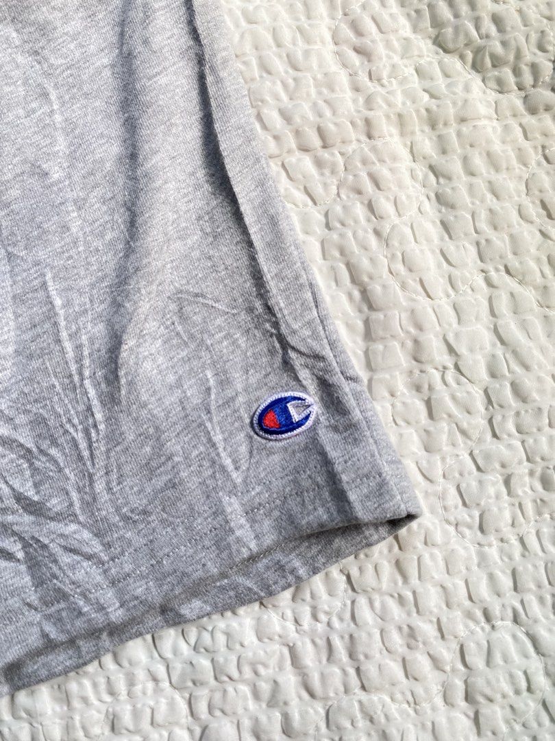 Champion Gray Sweatshorts Size L (Category: Shorts) located in Iloilo. Submitted by chapxythriftshop (Listing ID 1467195309, Image 2). Description: - Brand: Champion - Color: Heather Gray - Size: Large - Material: Soft fleece interior lining (Made in Pakistan) - Waistband: Elastic with printed branding and adjustable drawstring - Pockets: Two side pockets and one right back pocket - Branding: Small embroidered Champion logo patch on the lower lef