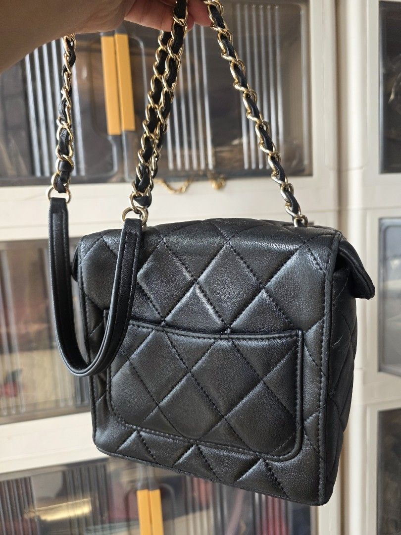 Chanel Black Quilted Vanity Bag Gold Hardware (Category: Luxury Bags & Wallets) located in Lemery. Submitted by venus23 (Listing ID 1467176767, Image 2). Description: -Chanel black quilted vanity bag - Classic diamond quilted leather with gold-tone hardware - Iconic interlocking CC logo on the front - Intertwined leather and gold chain strap - Structured boxy shape with 4 protective metal feet - Convenient external back slip pocket - Secure zippe