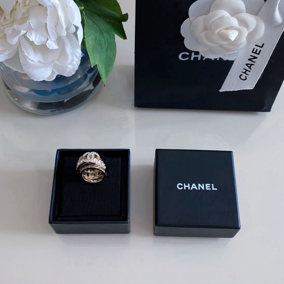 Chanel Crystal CC Quilted Triple Ring Set Gold (Category: Rings) located in Quezon City. Submitted by imbangalas71228 (Listing ID 1467234990, Image 2). Description: Chanel triple ring set in gold tone. Includes one band with a crystal-pave CC logo, one band lined with sparkling crystals, and two quilted bands with subtle CC engravings. Wear them stacked together or separately. Comes with the original black presentation box, care card, and packagi