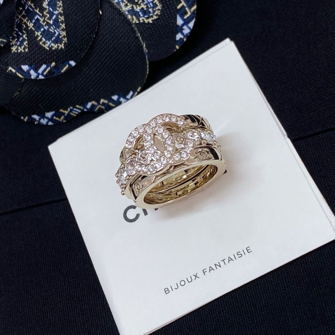 Chanel Crystal CC Quilted Triple Ring Set Gold (Category: Rings) located in Quezon City. Submitted by imbangalas71228 (Listing ID 1467234990, Image 3). Description: Chanel triple ring set in gold tone. Includes one band with a crystal-pave CC logo, one band lined with sparkling crystals, and two quilted bands with subtle CC engravings. Wear them stacked together or separately. Comes with the original black presentation box, care card, and packagi