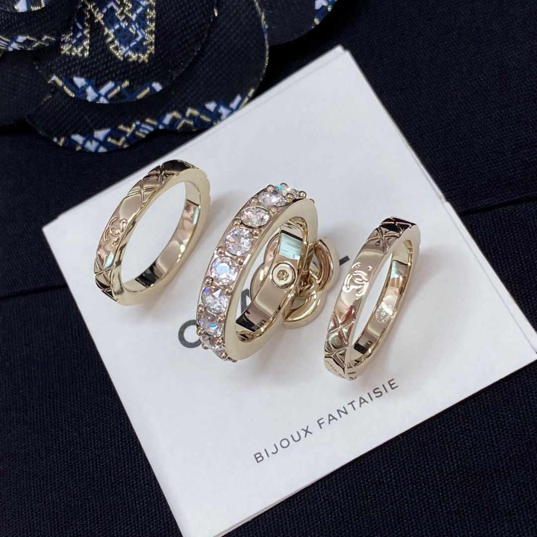 Chanel Crystal CC Quilted Triple Ring Set Gold (Category: Rings) located in Quezon City. Submitted by imbangalas71228 (Listing ID 1467234990, Image 1). Description: Chanel triple ring set in gold tone. Includes one band with a crystal-pave CC logo, one band lined with sparkling crystals, and two quilted bands with subtle CC engravings. Wear them stacked together or separately. Comes with the original black presentation box, care card, and packagi