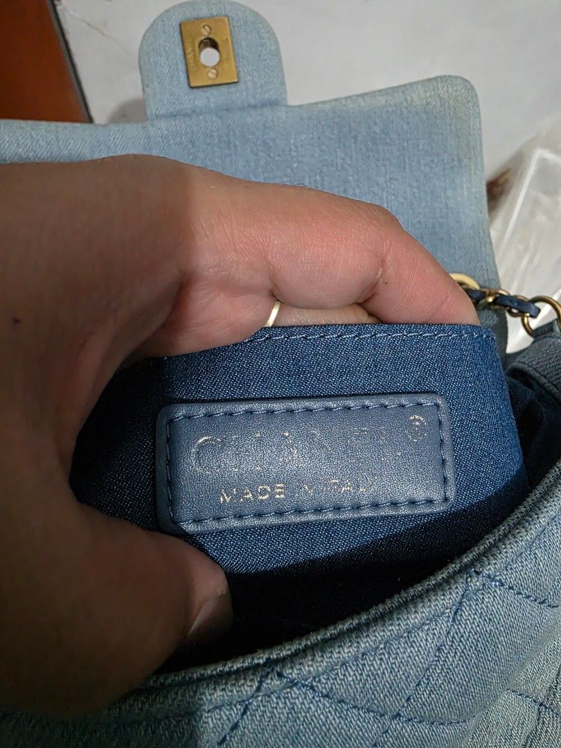 Chanel Quilted Denim Flap Bag Gold Hardware (Category: Luxury Bags & Wallets) located in Lemery. Submitted by venus23 (Listing ID 1467190665, Image 3). Description: - Chanel quilted denim double flap bag in a stunning light blue wash - Elegant gold-tone CC turn-lock closure and chain strap woven with blue leather - Features a charming leather ball accent with the iconic CC logo - Blue fabric interior lining with Chanel Made in Italy leather tag a