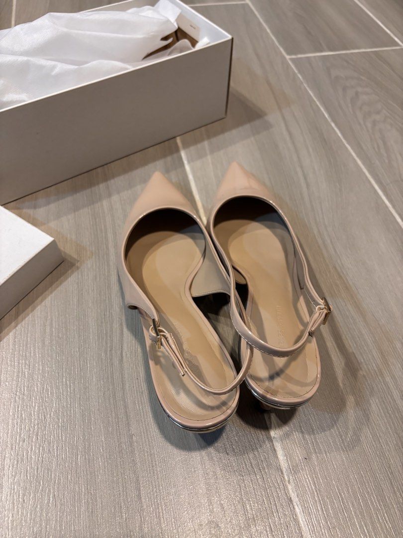 Charles & Keith Beige Slingback Pumps (Category: Heels) located in San Pedro. Submitted by lala_leila (Listing ID 1467329813, Image 3). Description: - Brand: Charles & Keith - Size: 41 / 27cm - Style: Nude patent leather slingback pumps with low block heel - Details: Pointed toe, adjustable buckle strap, clean insoles, and glossy uppers - Condition: Great, includes original white branded shoebox - Versatility: Perfect neutral color that matches v