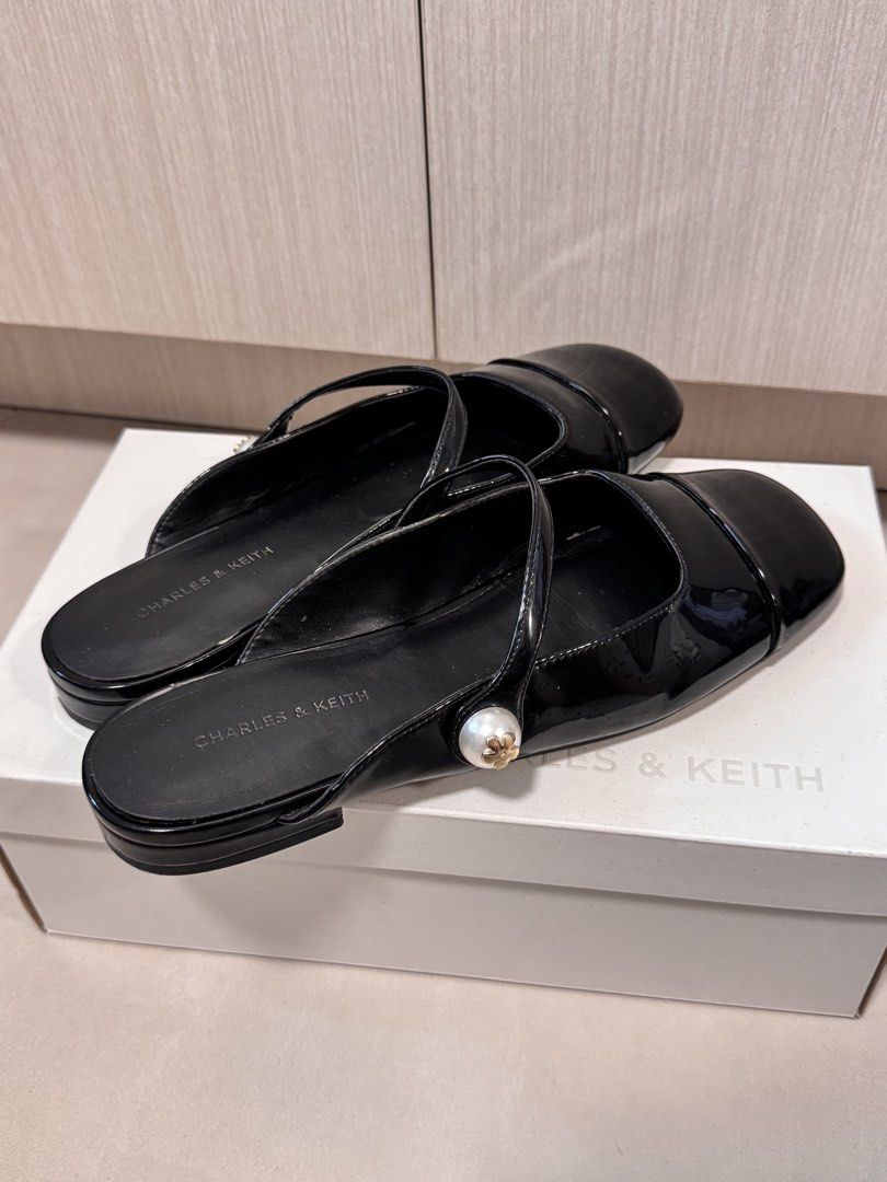 Charles & Keith Flats (Category: Flats & Sandals) located in Pasig City. Submitted by quintanajen (Listing ID 1467272607, Image 3). Description: Charles & Keith Flats/Mule Covered Open-Back type Size: 38 With original box Bought at orig price ₱2k+ Issues: chipped off part on the inner sole on left foot (see last photo) .