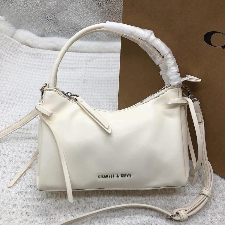 Charles & Keith Shoulder Bag Crossbody (Category: Cross-body Bags) located in Manila. Submitted by clairetot (Listing ID 1467202777, Image 1). Description: Brand new Charles & Keith handbag featuring a clean minimalist design, top handle with protective wrapping, and a detachable strap. Includes a secure top zip closure, interior tag, and subtle metallic front branding. Available in white, pink, and black..