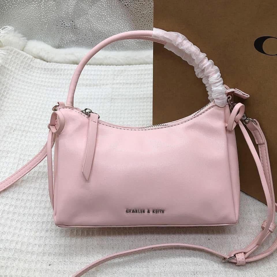 Charles & Keith Shoulder Bag Crossbody (Category: Cross-body Bags) located in Manila. Submitted by clairetot (Listing ID 1467202777, Image 2). Description: Brand new Charles & Keith handbag featuring a clean minimalist design, top handle with protective wrapping, and a detachable strap. Includes a secure top zip closure, interior tag, and subtle metallic front branding. Available in white, pink, and black..