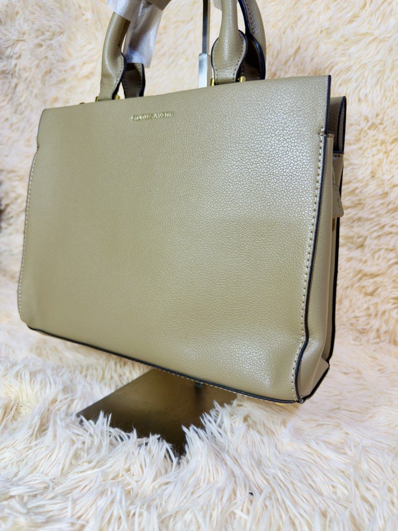 Charles & Keith taupe structured tote bag (Category: Tote Bags) located in Caloocan City. Submitted by hirahira.co (Listing ID 1467285701, Image 2). Description: - Brand: Charles & Keith - Style: Black Ribbon Tote Bag / Handbag - Color: Classic Black - Features: Elegant front ribbon detail, top carry handles with protective wrapping, secure interior zippered pocket - Condition: Brand new, pristine condition - Versatile design suitable for casual 
