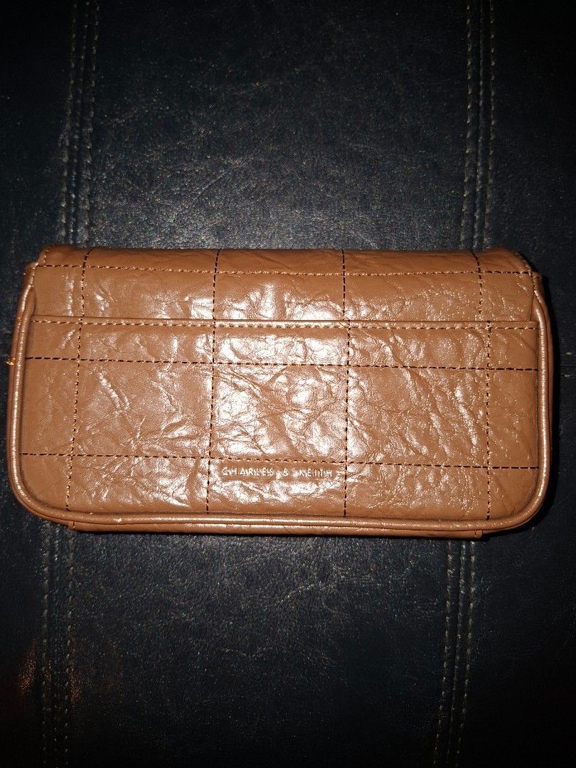 Charles and Keith Sling Bag (Category: Cross-body Bags) located in Pasig City. Submitted by al_is_war (Listing ID 1467195805, Image 2). Description: Original Charles and Keith bag. Like new, with dust bag..