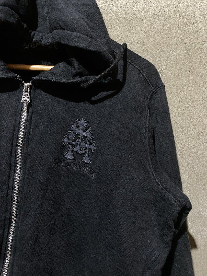 Chrome Hearts Cross Patch Zip-Up Hoodie Black (Category: Hoodies) located in Manila. Submitted by krip_thrift (Listing ID 1467249231, Image 3). Description: Chrome Hearts zip-up hoodie in black. Heavy cotton fabric with multiple cross patches running down the back. Triple cross embroidery on the left chest and CH logo near the front pocket. Silver dagger zipper pull and engraved aglets on the drawstrings. Inner neck tag attached. best fit: medium