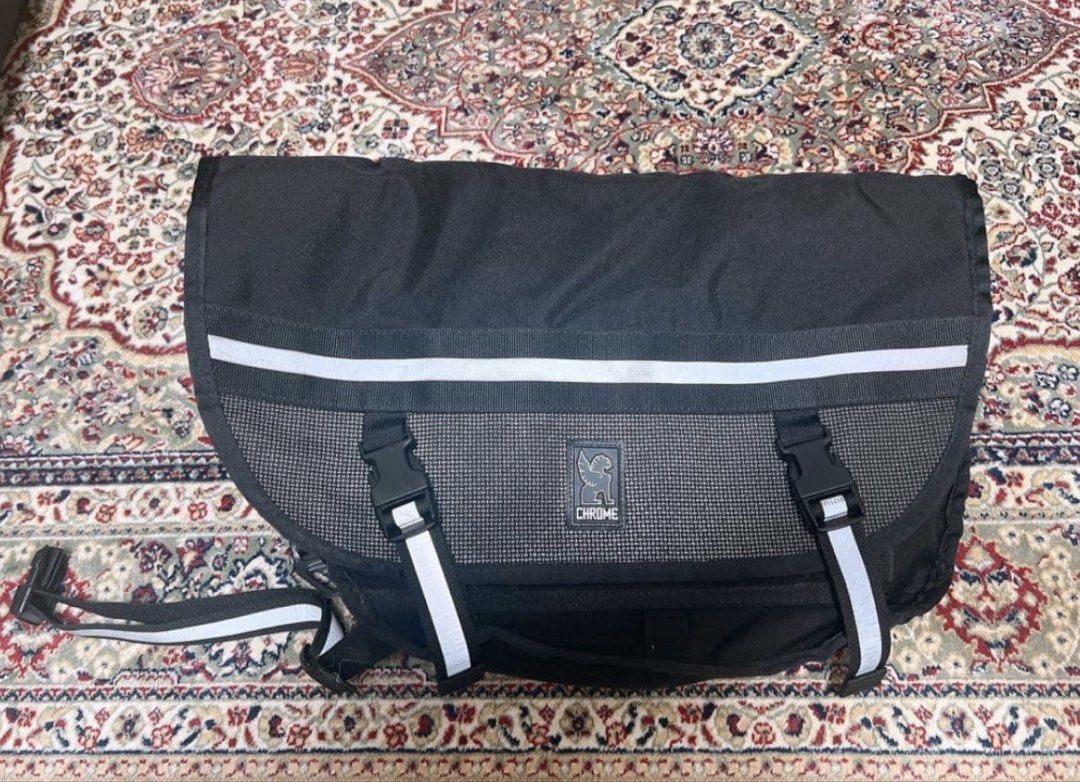 Chrome Industries Night Series Messenger Bag (Category: Sling Bags) located in Calamba. Submitted by youngraven (Listing ID 1467200311, Image 1). Description: - Brand: Chrome (Night Series) - Color: Black - Material: Heavy-duty Cordura with waterproof tarpaulin lining - Features: Iconic seatbelt buckle closure with gryphon logo, reflective front stripes, multiple zippered organizer pockets - Origin: American made tag intact - Condition: Built to 