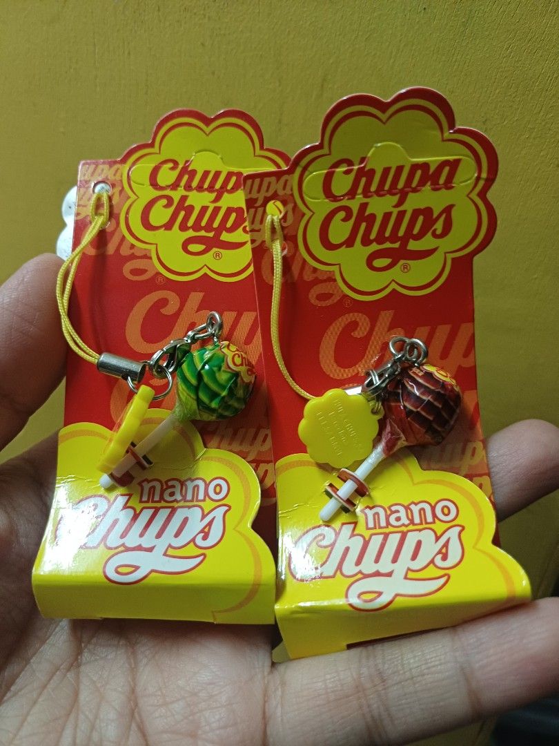 Chupa Chups Nano Chups Keychain Charm (Category: Charms) located in La Trinidad. Submitted by algervin1050867 (Listing ID 1467253821, Image 1). Description: - Set of 2 Chupa Chups lollipop charms (Red & Green) - Comes with original phone straps and backing cards - Model SH-483 from the 14 to collect series - Brand new and unopened packaging - Perfect for candy fans and collectors.