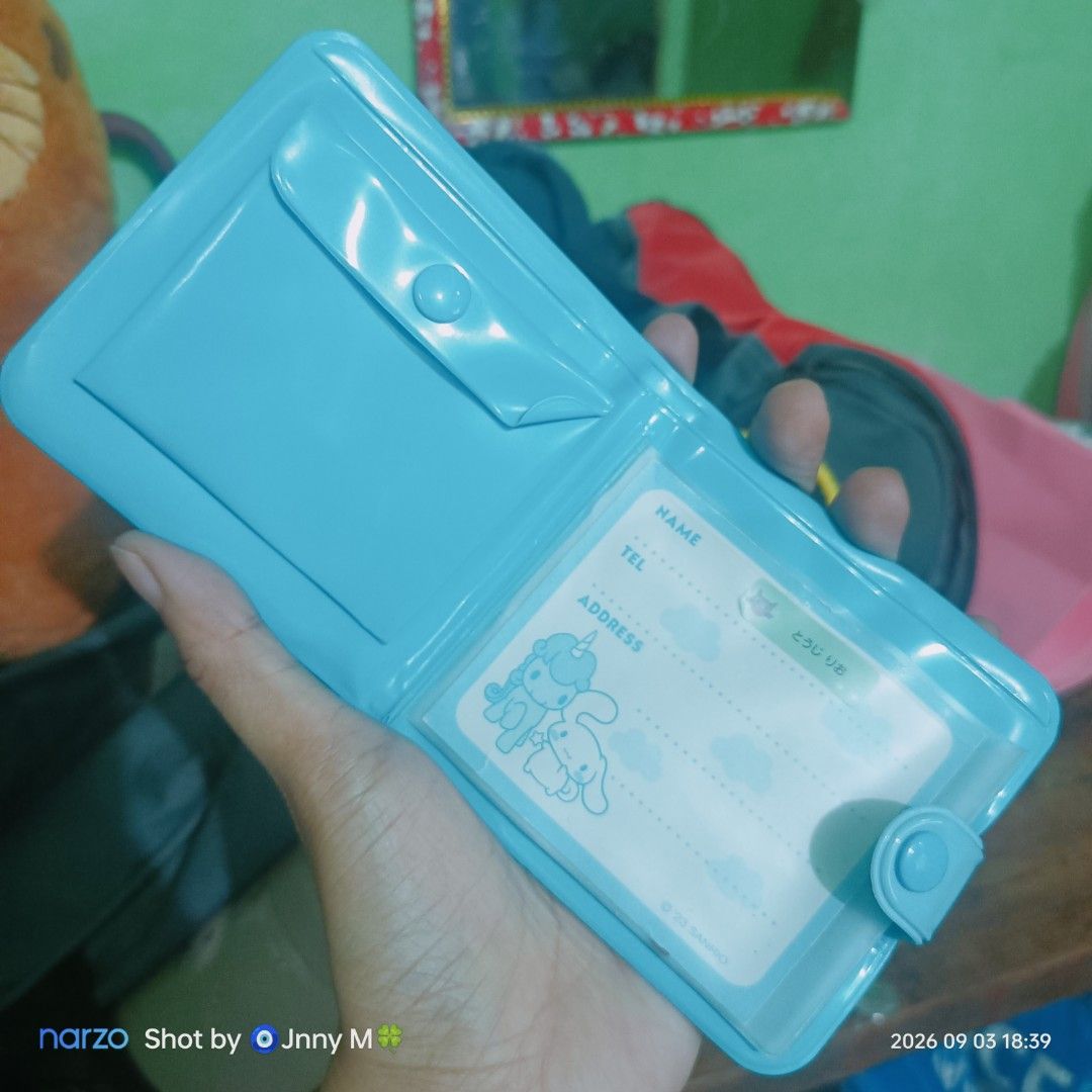 Cinnamoroll blue plastic wallet with coin pocket (Category: Wallets & Card holders) located in Taguig. Submitted by mhayestufftoys (Listing ID 1467352648, Image 2). Description: - Authentic Sanrio Cinnamoroll design in a sweet light blue color - Front graphic features Cinnamoroll riding a magical unicorn with playful text - Secure snap button main closure - Convenient inner coin pouch with snap closure - Built-in ID card slot complete with name, 