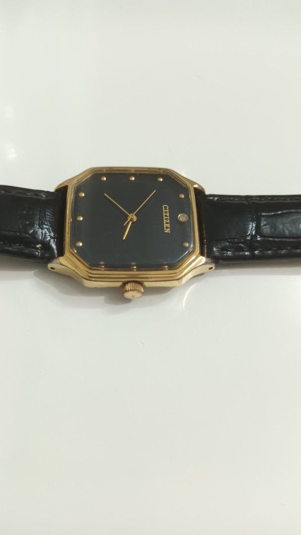 Citizen Vintage Gold-Tone watch (Category: Women's Watches) located in Manila. Submitted by elytoot_1891 (Listing ID 1467247809, Image 3). Description: - Brand: Citizen mechanical watch hand winding - Style: Vintage classic dress watch - Dial: Striking black octagonal face with minimalist dot markers and slim gold hands - Case: Gold-tone with stainless steel back and clear serial numbers - Strap: Genuine Italian black leather strap with silver-to