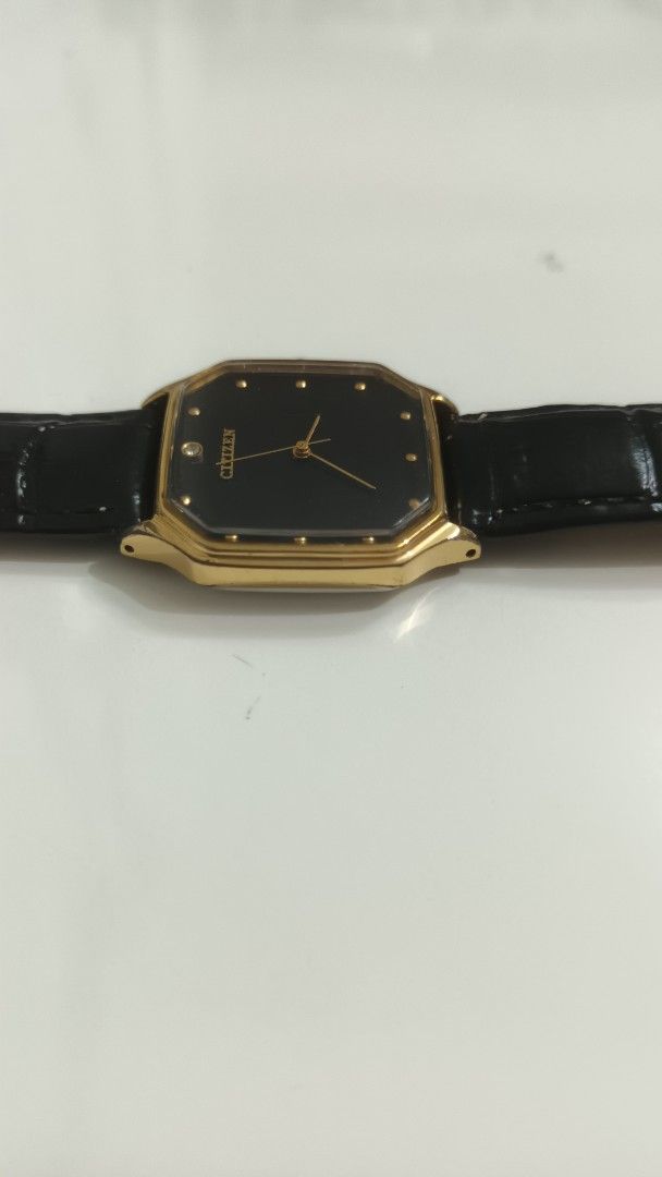 Citizen Vintage Gold-Tone watch (Category: Women's Watches) located in Manila. Submitted by elytoot_1891 (Listing ID 1467247809, Image 2). Description: - Brand: Citizen mechanical watch hand winding - Style: Vintage classic dress watch - Dial: Striking black octagonal face with minimalist dot markers and slim gold hands - Case: Gold-tone with stainless steel back and clear serial numbers - Strap: Genuine Italian black leather strap with silver-to