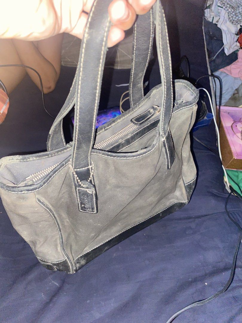 Coach Black Tote Bag B0K-7708 (Category: Luxury Bags & Wallets) located in Manila. Submitted by togekimiwa (Listing ID 1467327608, Image 1). Description: - Brand: Coach - Color: Black - Material: Durable fabric with leather trim - Features: Dual handles, secure zip-top main compartment, original hangtag, and interior creed patch with serial number (B0K-7708) - Condition: Visible wear throughout the exterior and leather accents, with a noticeable 