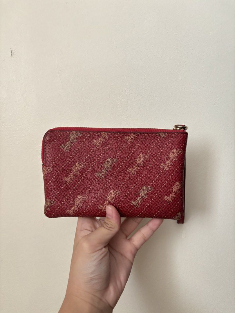 Coach Corner Zip Wristlet (Category: Wallets & Card holders) located in Manila. Submitted by gabuys (Listing ID 1467229603, Image 2). Description: * Barely used * No issues .