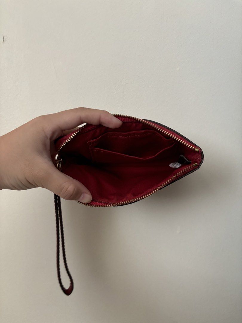 Coach Corner Zip Wristlet (Category: Wallets & Card holders) located in Manila. Submitted by gabuys (Listing ID 1467229603, Image 3). Description: * Barely used * No issues .