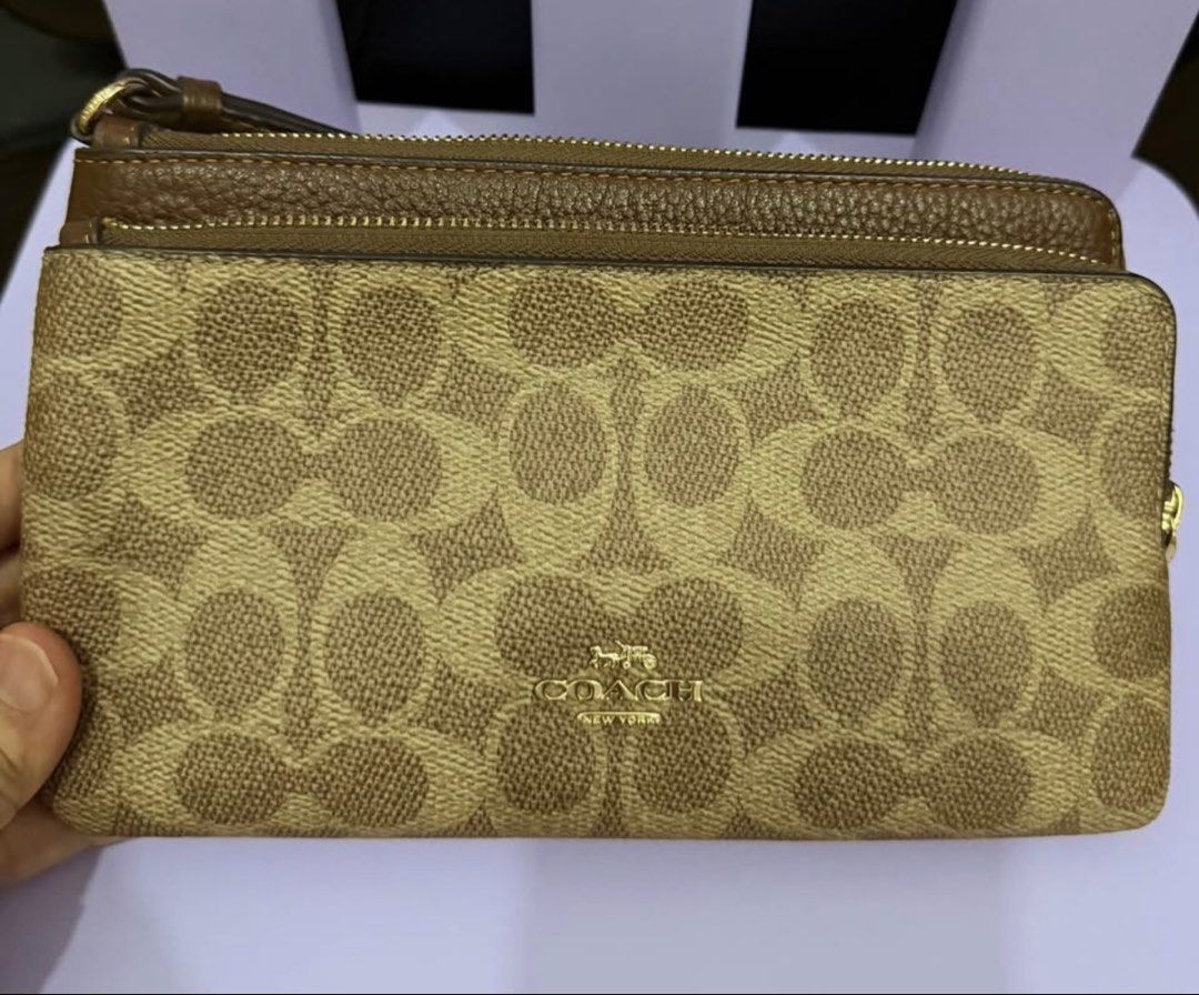 Coach Double Zip Wallet (Category: Luxury Bags & Wallets) located in Manila. Submitted by 08sophia (Listing ID 1467230794, Image 1). Description: Coach Double Zip Wallet / Wrislet. Signature Canvass. 100% authentic. Bought in Coach Outlet store in Canada. Good as new. No flaws. Kasya promax.