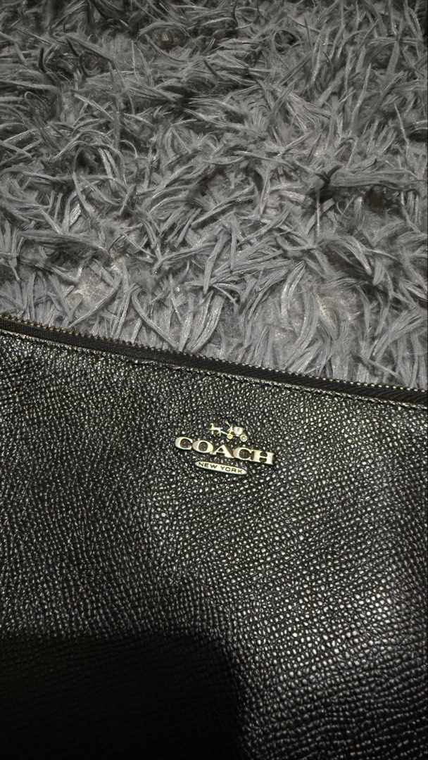 Coach Leather Crossbody Bag Black (Category: Cross-body Bags) located in San Pedro. Submitted by _eyamarie (Listing ID 1467211478, Image 2). Description: Coach black pebbled leather crossbody bag. Gold-tone hardware and Coach New York logo on front. Exterior slip pocket on the back. Zipper closure on top with fabric lining and card slots inside. Adjustable and removable strap with chain detail. Style number 52385, made in Vietnam..