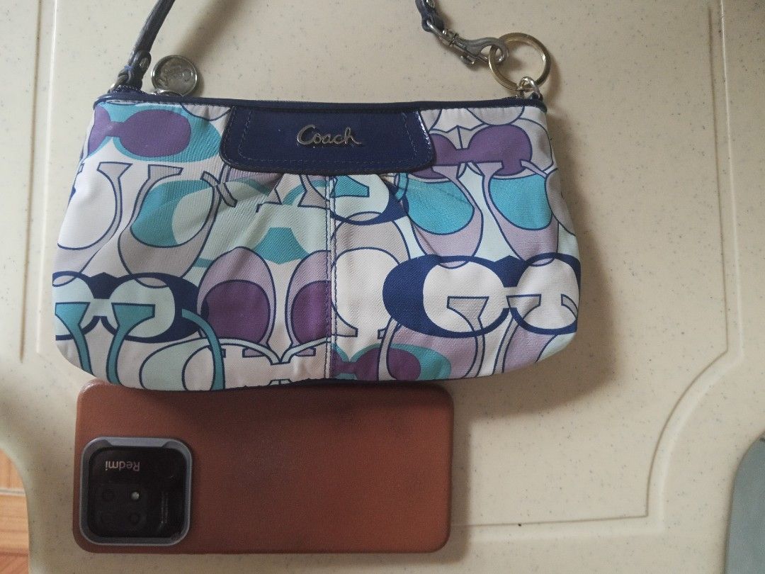 Coach Mini Shoulder Bag (Category: Luxury Bags & Wallets) located in Makati City. Submitted by makati_metro (Listing ID 1467226261, Image 3). Description: In almost perfect condition. Clean, well-kept, and free from unpleasant odors. A lovely mini shoulder bag that fits your phone and everyday essentials like lippies, powder, and other small items. Comes with interior card pockets for added convenience. What you see is what you get. Kindly check 