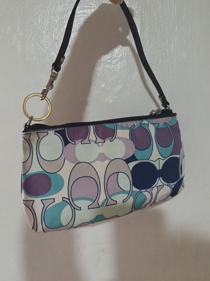 Coach Mini Shoulder Bag (Category: Luxury Bags & Wallets) located in Makati City. Submitted by makati_metro (Listing ID 1467226261, Image 2). Description: In almost perfect condition. Clean, well-kept, and free from unpleasant odors. A lovely mini shoulder bag that fits your phone and everyday essentials like lippies, powder, and other small items. Comes with interior card pockets for added convenience. What you see is what you get. Kindly check 