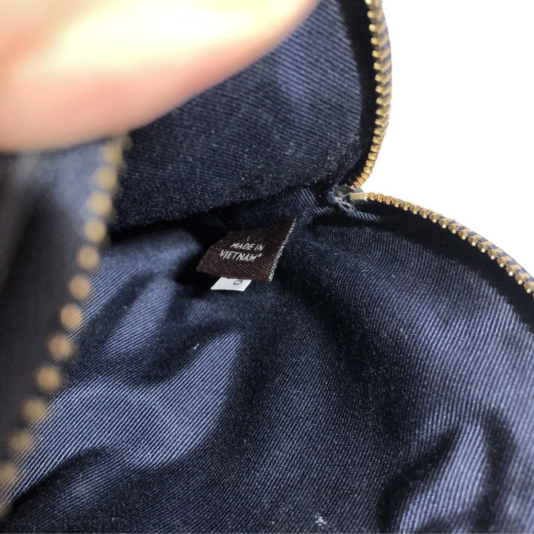 Coach Navy Blue Cosmetic Pouch (Category: Purses & Pouches) located in Manila. Submitted by all.dressed.up (Listing ID 1467362186, Image 3). Description: Brand: Coach Color: Dark navy blue textured leather Hardware: Gold tone with debossed details Interior: Clean dark blue fabric lining with Made in Vietnam tag Features: Smooth zipper closure, compact size ideal for makeup, keys, and cards Condition: Excellent, clean inside and out Strictly no re