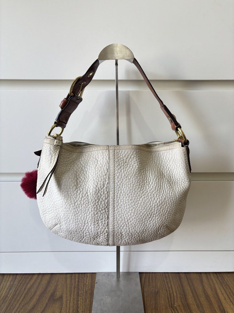 Coach Soho White Pebbled Leather Hobo (Category: Luxury Bags & Wallets) located in Manila. Submitted by vintage.maem (Listing ID 1467324572, Image 2). Description: CCH Soho White Pebbled Leather Hobo Code: 11838 *𝘤𝘩𝘢𝘳𝘮 𝘯𝘰𝘵 𝘪𝘯𝘤𝘭𝘶𝘥𝘦𝘥* Condition: 7.6/10 Rank B Mine: ₱1999 ⚠️ Signs of wear on leather, minimal pen mark (see 3rd photo), rubber lining issue near handle (see 4th photo), dirt on inner lining near zippers (see 5th and 6th p