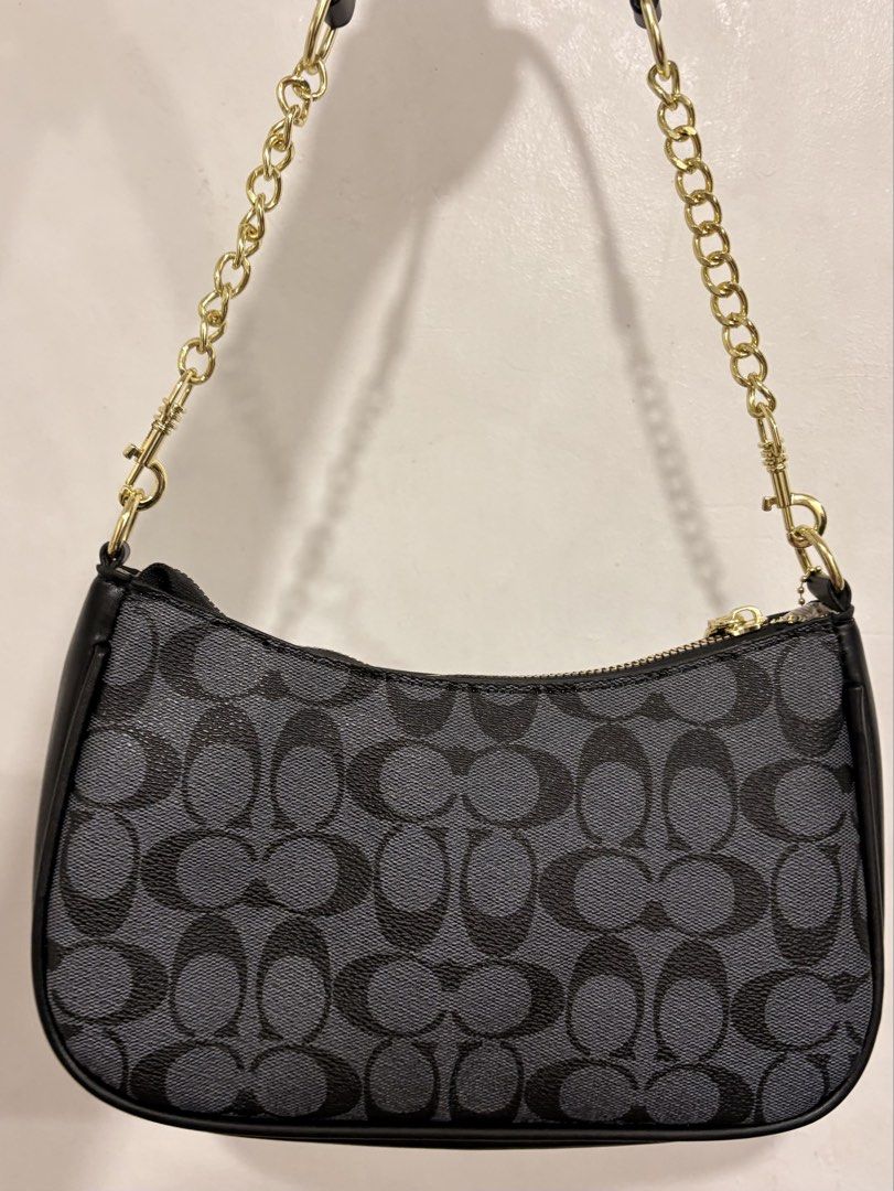COACH TERI SHOULDER BAG – BLACK/GRAY 🩶 (Category: Luxury Bags & Wallets) located in Manila. Submitted by iceexx (Listing ID 1467312587, Image 3). Description: COACH TERI SHOULDER BAG – BLACK/GRAY ✨ BRAND NEW | ₱799 ONLY! ✨ (REPRICED ₱550) Selling this beautiful Coach Teri Shoulder Bag in Signature Canvas with gold hardware. Classy, stylish, and perfect for everyday use or going out! Easy to match with any outfit. ✨ Details: • Brand: Coach • Mode