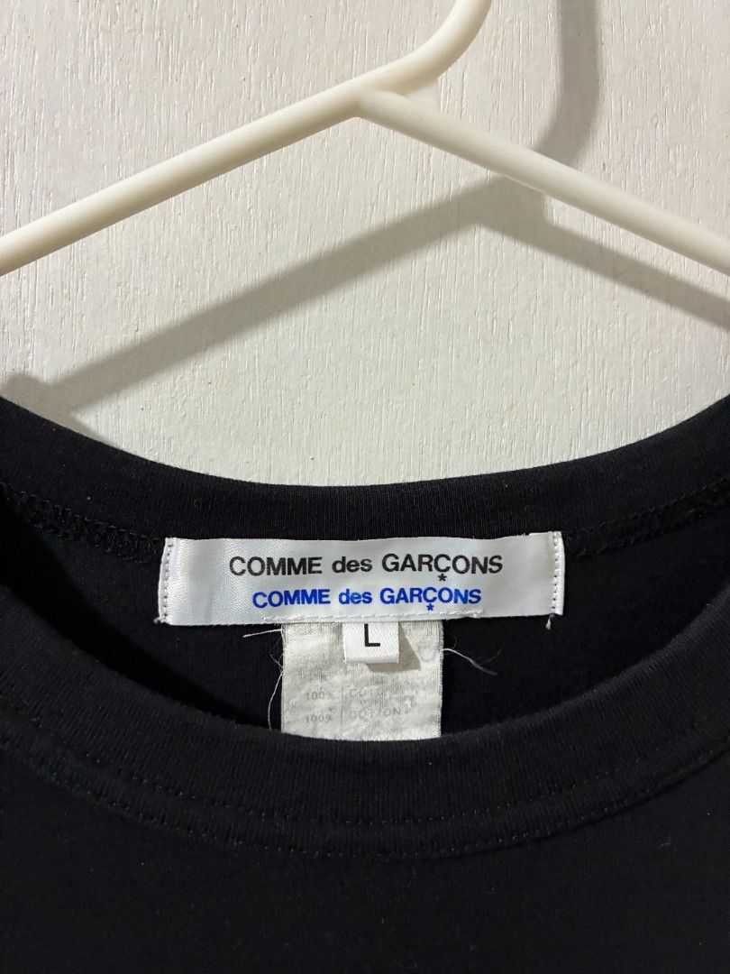 Comme des Garcons Patterned Hem T-shirt (Category: Luxury Apparel) located in Santo Tomas. Submitted by tamins.thrifts (Listing ID 1467357937, Image 3). Description: Condition: 9/10 Color Rate: 9/10 Dimensions: 18 x 25 Issue/s:.