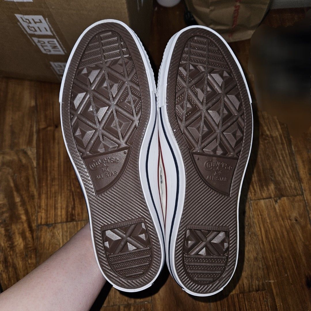 Converse All Star Slip-On White Sneakers (Category: Sneakers) located in San Juan City. Submitted by irene.lim2 (Listing ID 1467337911, Image 2). Description: - Brand: Converse All Star - Size: US 7.5 - Style: Low-top slip-on sneakers - Color: White with signature red piping - Features: Elastic laces for easy on and off - Sole: Brown rubber outsole with great traction tread - Condition: Brand new never used Sold as is. Shipping or delivery fee on
