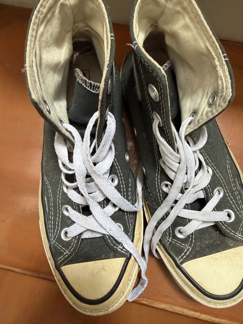 Converse Chuck Taylor All Star 70s High Top (Category: Sneakers) located in Makati City. Submitted by chewyy.j (Listing ID 1467191219, Image 2). Description: - Color: Black canvas with white laces and cream rubber soles - Design: High-top with classic Chuck Taylor inner ankle patches and heel branding - Condition: Shows gentle signs of wear on the canvas and soles - Durability: Sturdy and dependable, perfect for everyday casual wear.