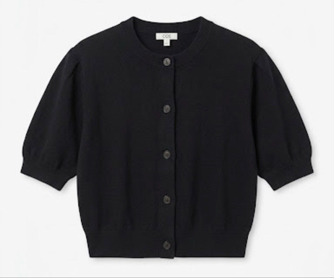 COS Cardigan Black S (Category: Coats, Jackets and Outerwear) located in Donsol. Submitted by saksthriftavenuebyluckymaria8 (Listing ID 1467354727, Image 3). Description: - Brand: COS - Color: Black - Size: EUR L - Details: Short sleeves, round neckline, front button closure - Fit: Cropped silhouette with ribbed hem and cuffs - Style: Minimalist and versatile for easy layering COS CROPPED KNIT SWEATER Sz S chest 23in armhole 9in shoulder 16in len