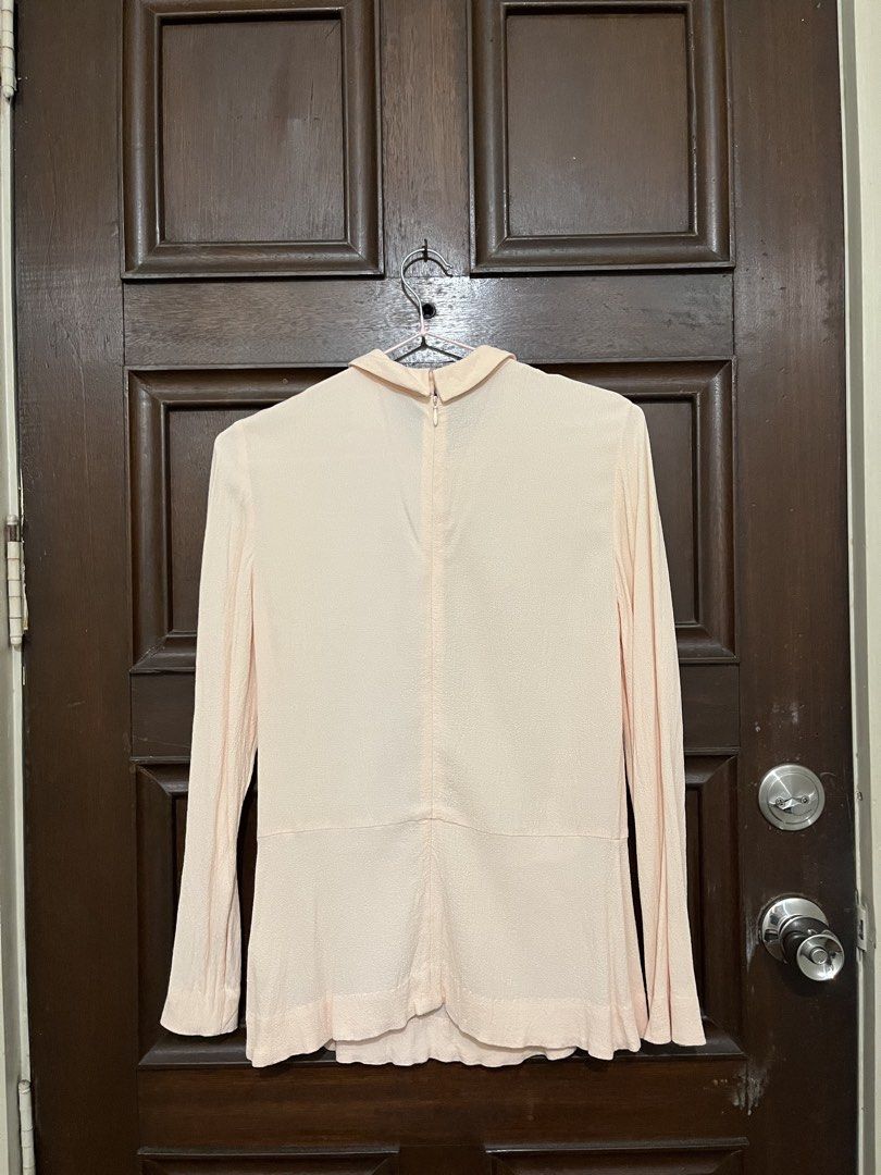 COS Peach Long Sleeve Blouse (Category: Longsleeves) located in Makati City. Submitted by yoursecondbest (Listing ID 1467252548, Image 2). Description: Fits 34 bust. Yellowish stain due to storage can be removed by wash. Pretty!.