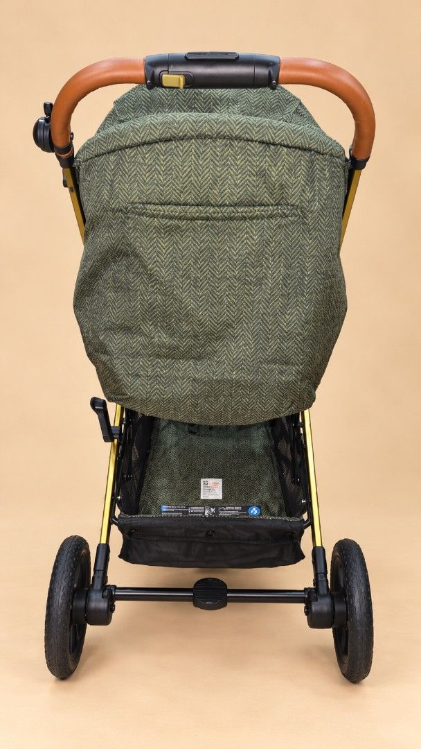 Cosatto Stroller Green Bird Pattern Gold Frame (Category: Strollers) located in Mandaluyong City. Submitted by jbird311 (Listing ID 1467342884, Image 3). Description: - Brand: Cosatto Stroller - Design: Stylish green with bird print canopy and inner lining - Frame & Wheels: Elegant gold-tone frame with black wheels - Handle: Premium brown leatherette handle grip - Storage: Spacious underseat basket made from recycled bottles - Comfort & Safety: Q