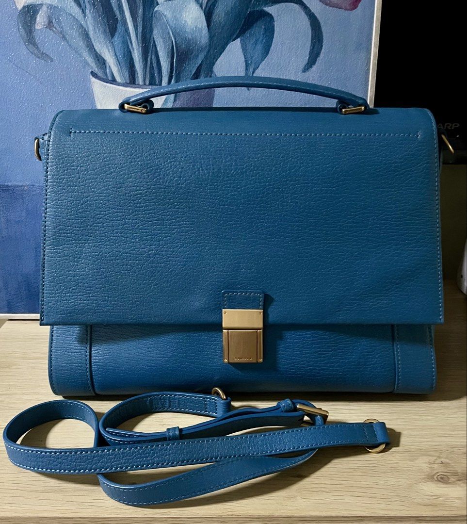 Couronne Satchel (Category: Clutches) located in Quezon City. Submitted by madshoppe (Listing ID 1467281392, Image 2). Description: No flaws Med to Large size for a top handle bag Teal color With sling Super pretty in person.