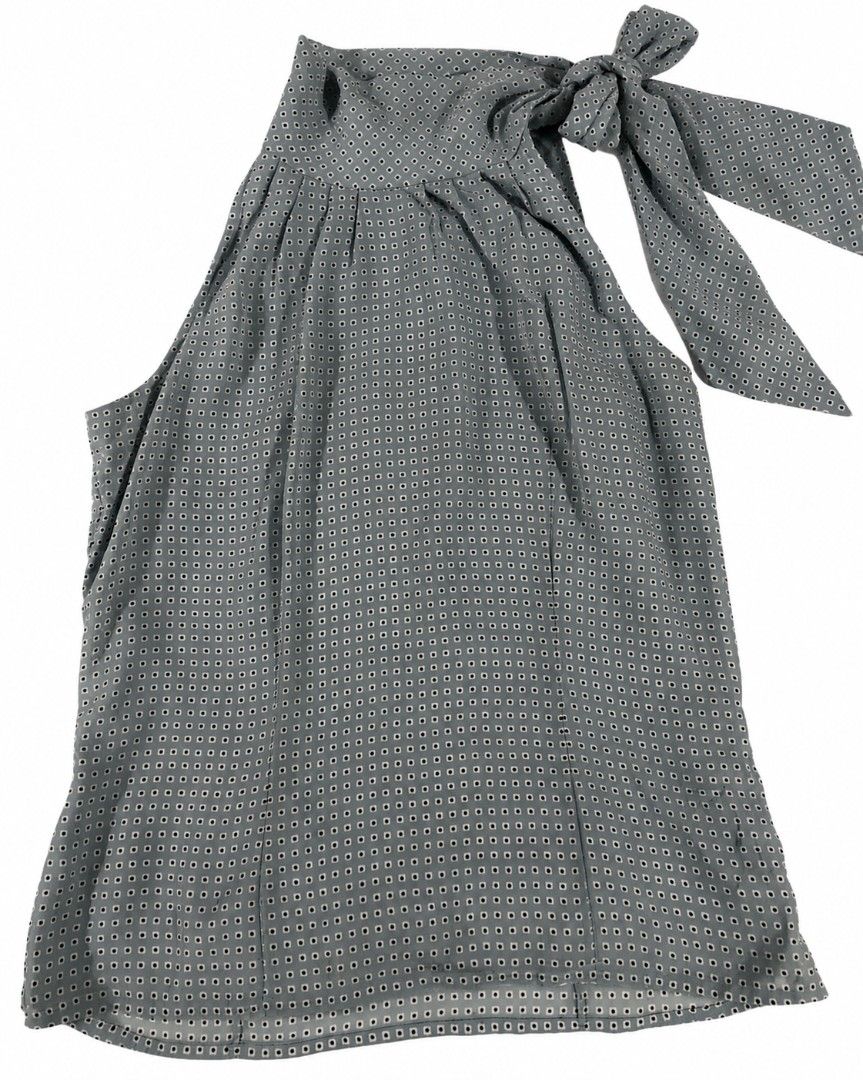 Cozzi Blue Geometric Print Sleeveless Halter Blouse (Category: Sleeveless) located in Kananga. Submitted by aurylien.clo (Listing ID 1467189391, Image 1). Description: - Brand: Cozzi - Dimes: L- 26, B- 28, W-30 - Size: L - Color/Pattern: Blue with small geometric square print - Neckline: Halter neck with side tie bow - Details: Pleated front drape - Fabric: Lightweight and comfortable.