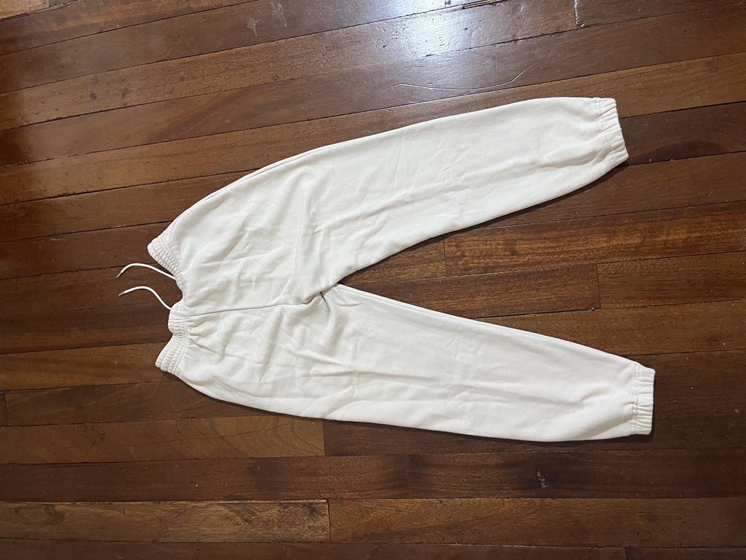 Cream Jogger Sweatpants Drawstring Cuffed Ankles (Category: Joggers) located in Quezon City. Submitted by silverriver_3cf939 (Listing ID 1467230199, Image 2). Description: - Color: Cream - Material: Soft fleece fabric - Fit & Features: Adjustable drawstring waist, elastic ankle cuffs, and dual side pockets - Condition: Clean with minimal wear - Style: Great for lounging or casual everyday errands.