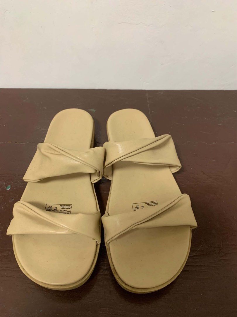Cream Sandals size 10W (wide) (Category: Flats & Sandals) located in Borongan. Submitted by kabes_jane (Listing ID 1467188915, Image 1). Description: - Color: Cream - Style: Slip-on sandals with twisted strap design - Size: 10 US - Condition: Clean, brand new, and ready to wear - Ideal for: Casual daily wear, beach trips, and warm weather outfits.